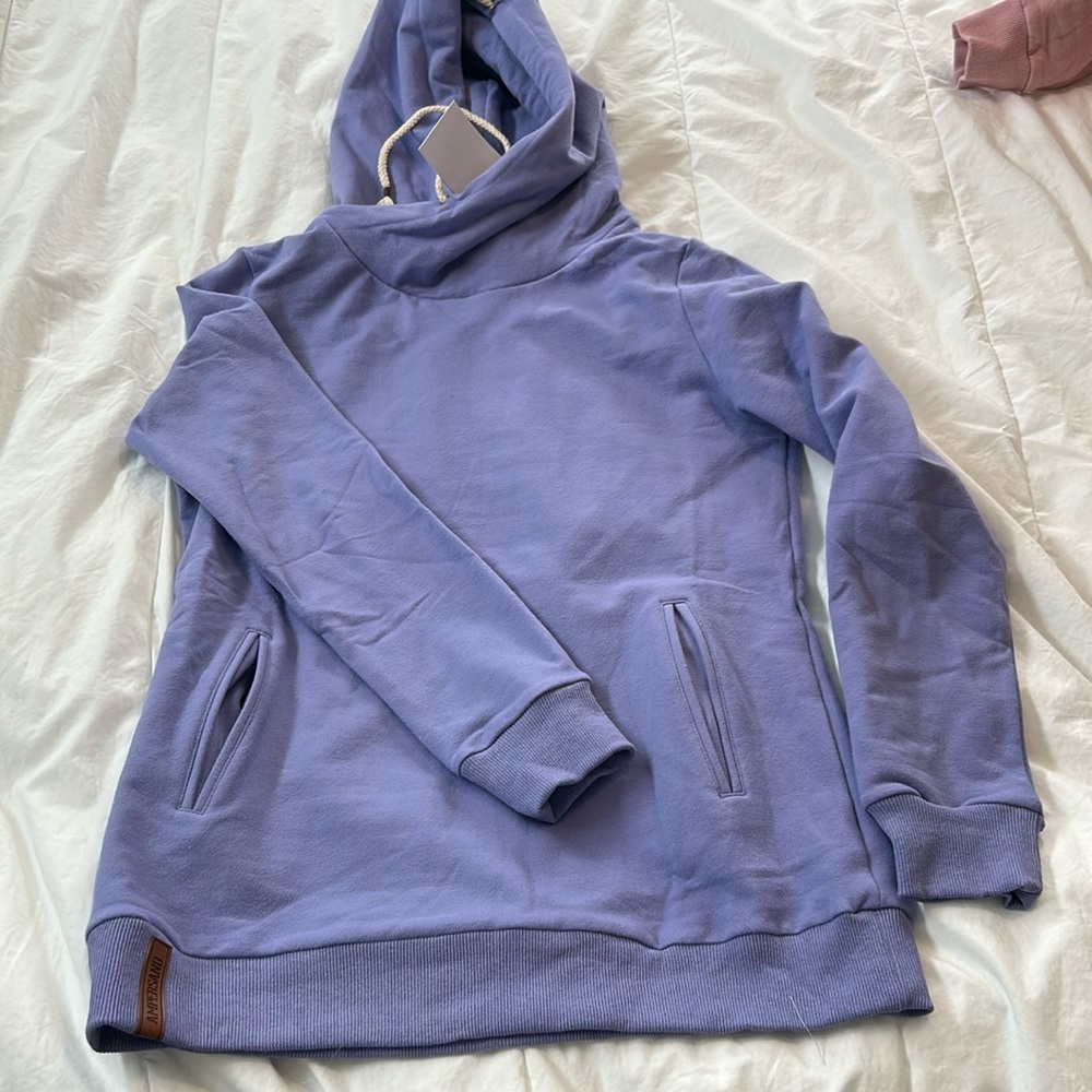 Purple single hood form Ampersand Avenue, with tags